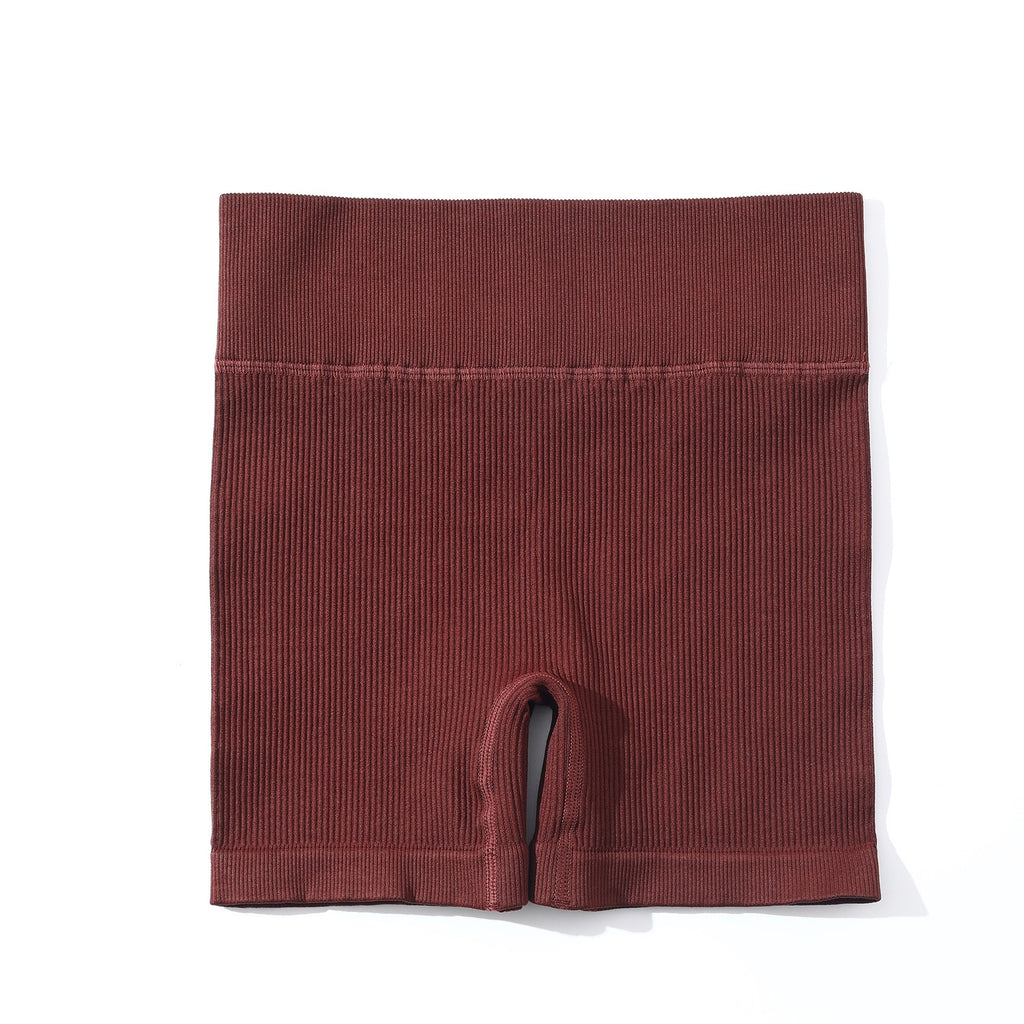 Conjunto deportivo europeo y americano de punto sin costuras para yoga, sujetador con tirantes y shorts para mujer.